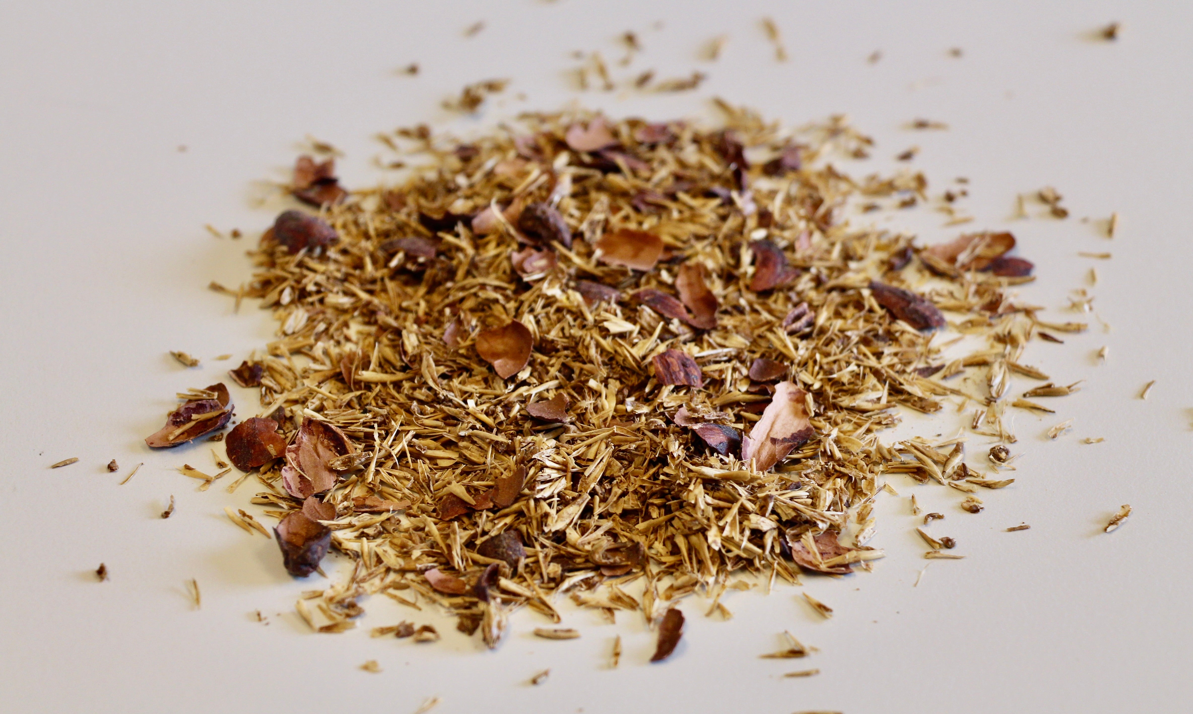Unmilled, dried cocoa husks and spent grain.